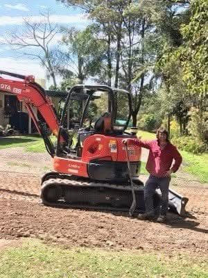 Kubota excavator on site with its owner — yellow plant finance